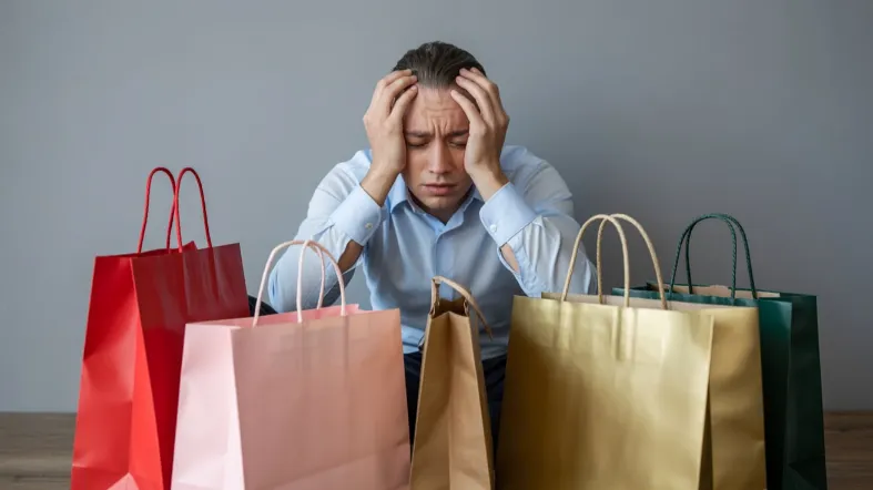 asmuo yra priklausomas nuo pinigų ir pirkinių